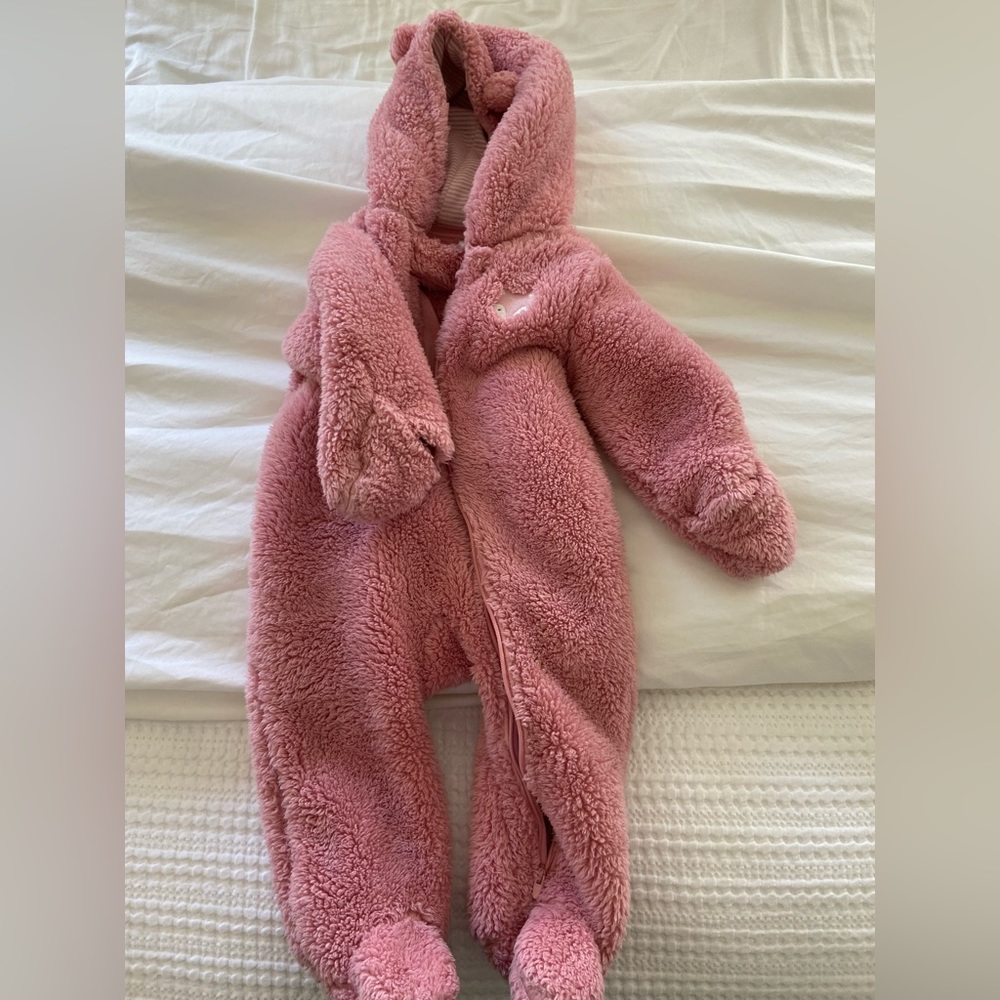 Carters pink winter onesie. Foot and hand covering.